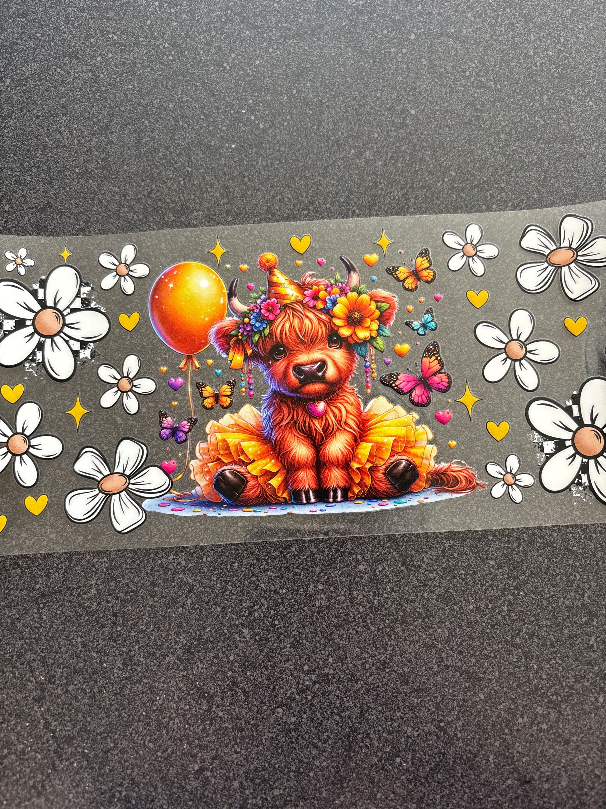 Birthday Highland cow with white flowers and yellow balloon