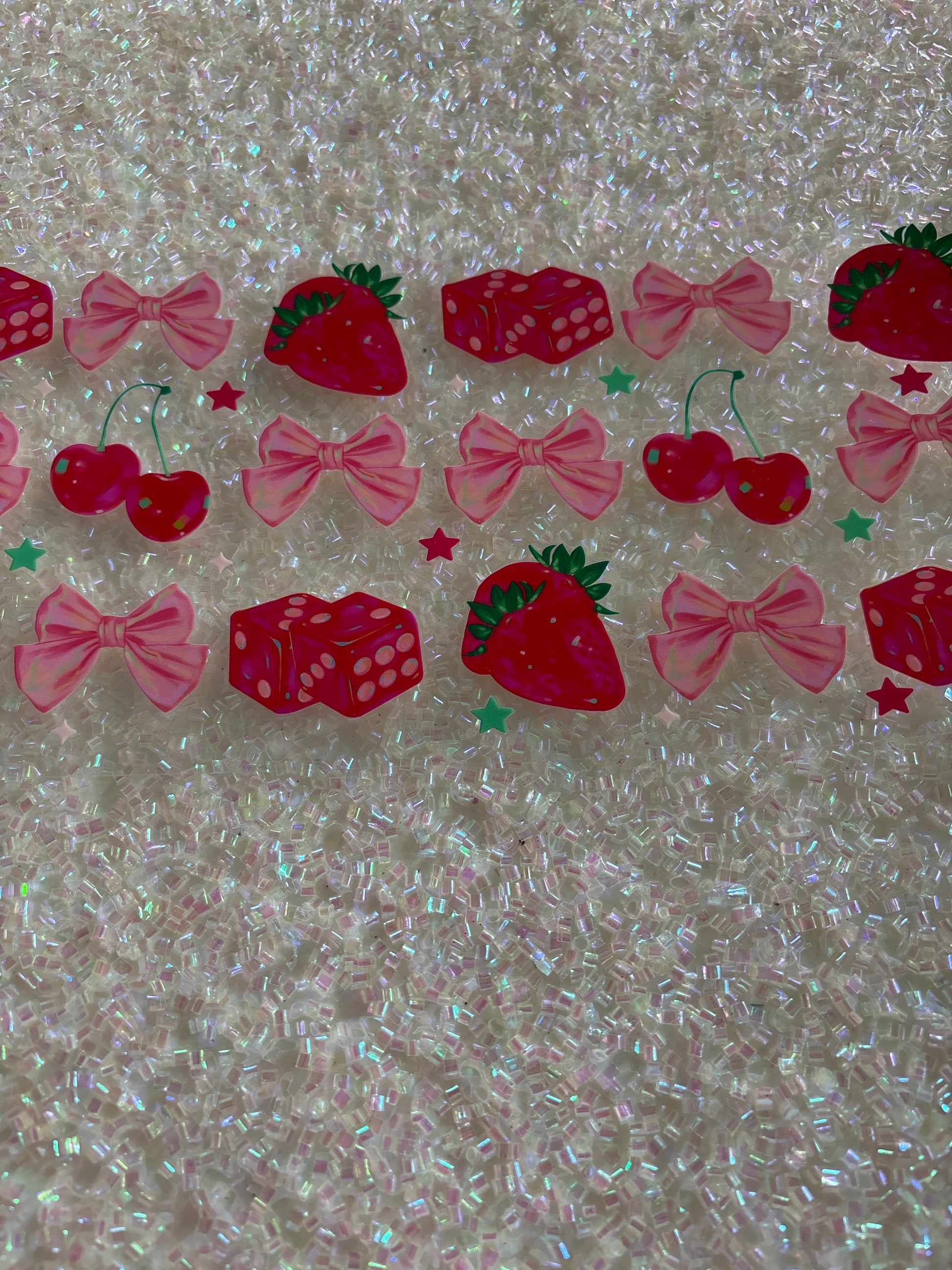 Strawberry bows, cherries and dice