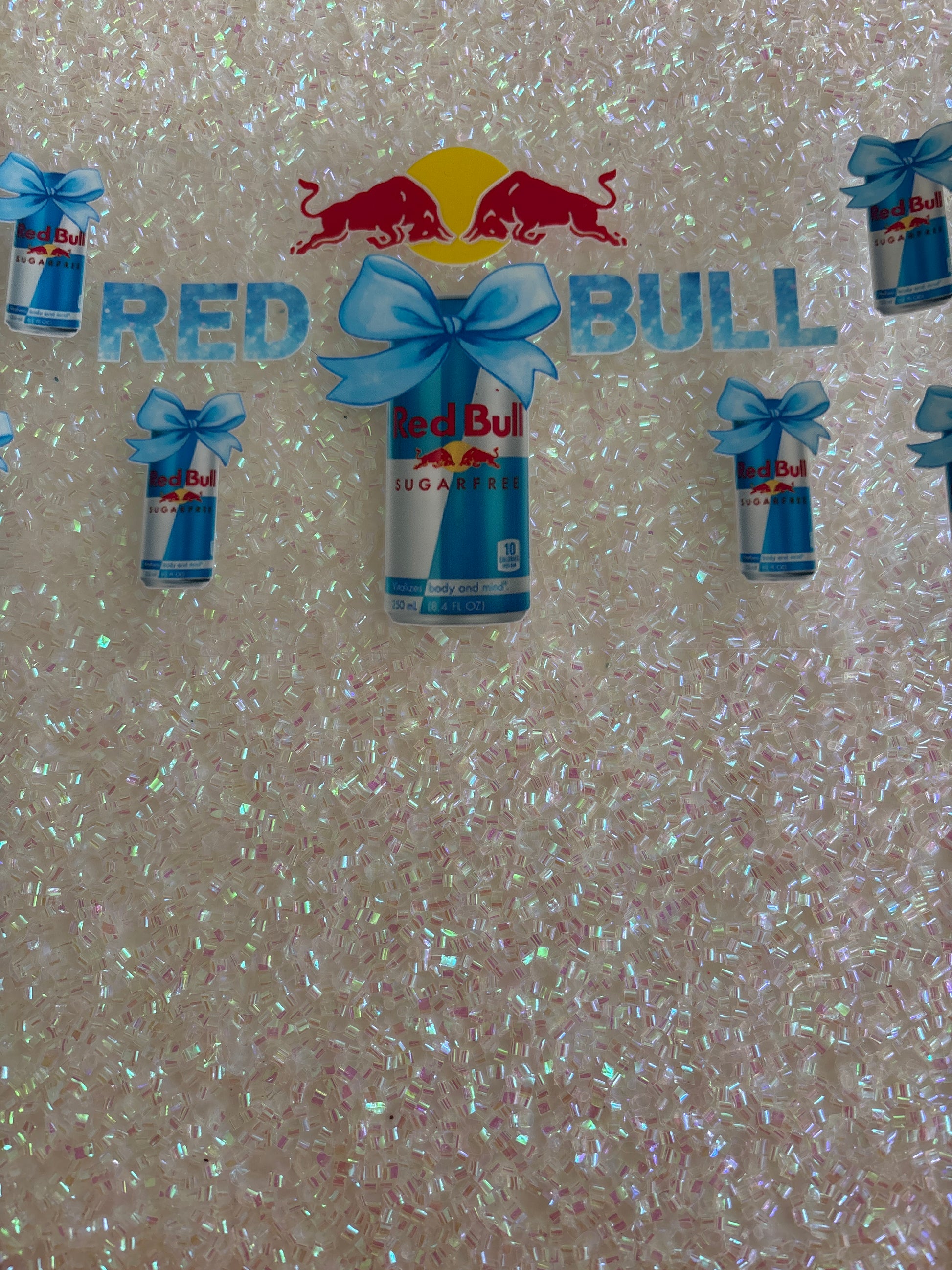 Red Bull can light blue bows
