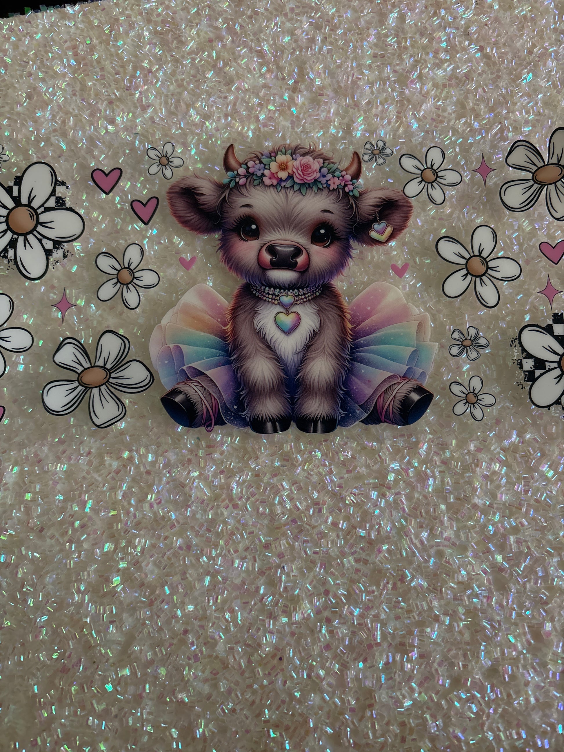 Baby Highland cow with rainbow skirt