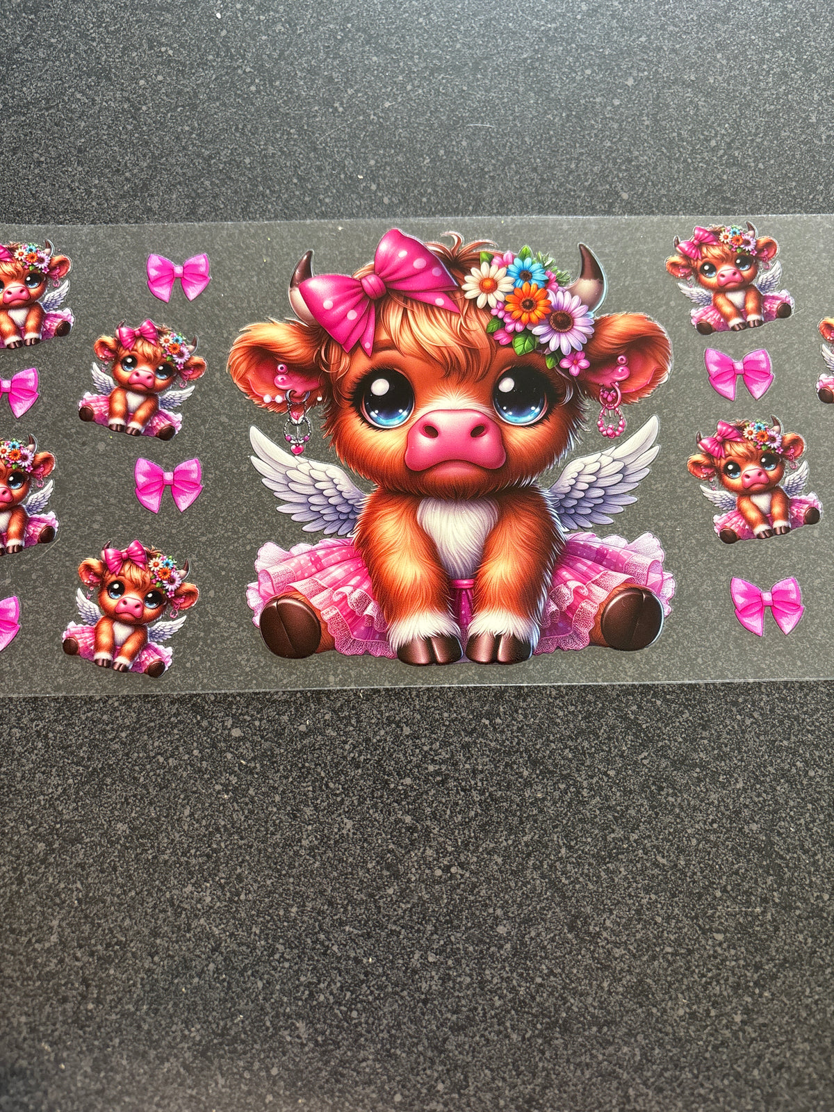 Highland cow with wings and pink bows