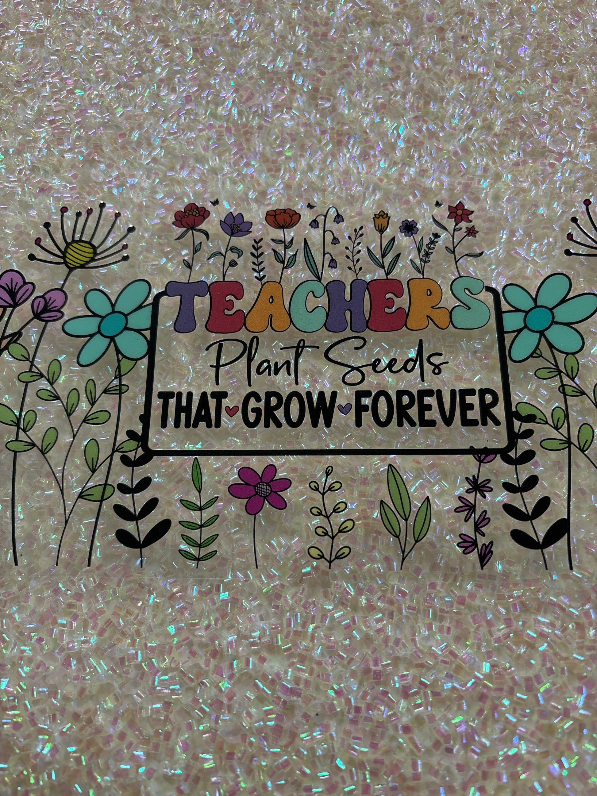 Teachers plant seeds that grow forever flowers