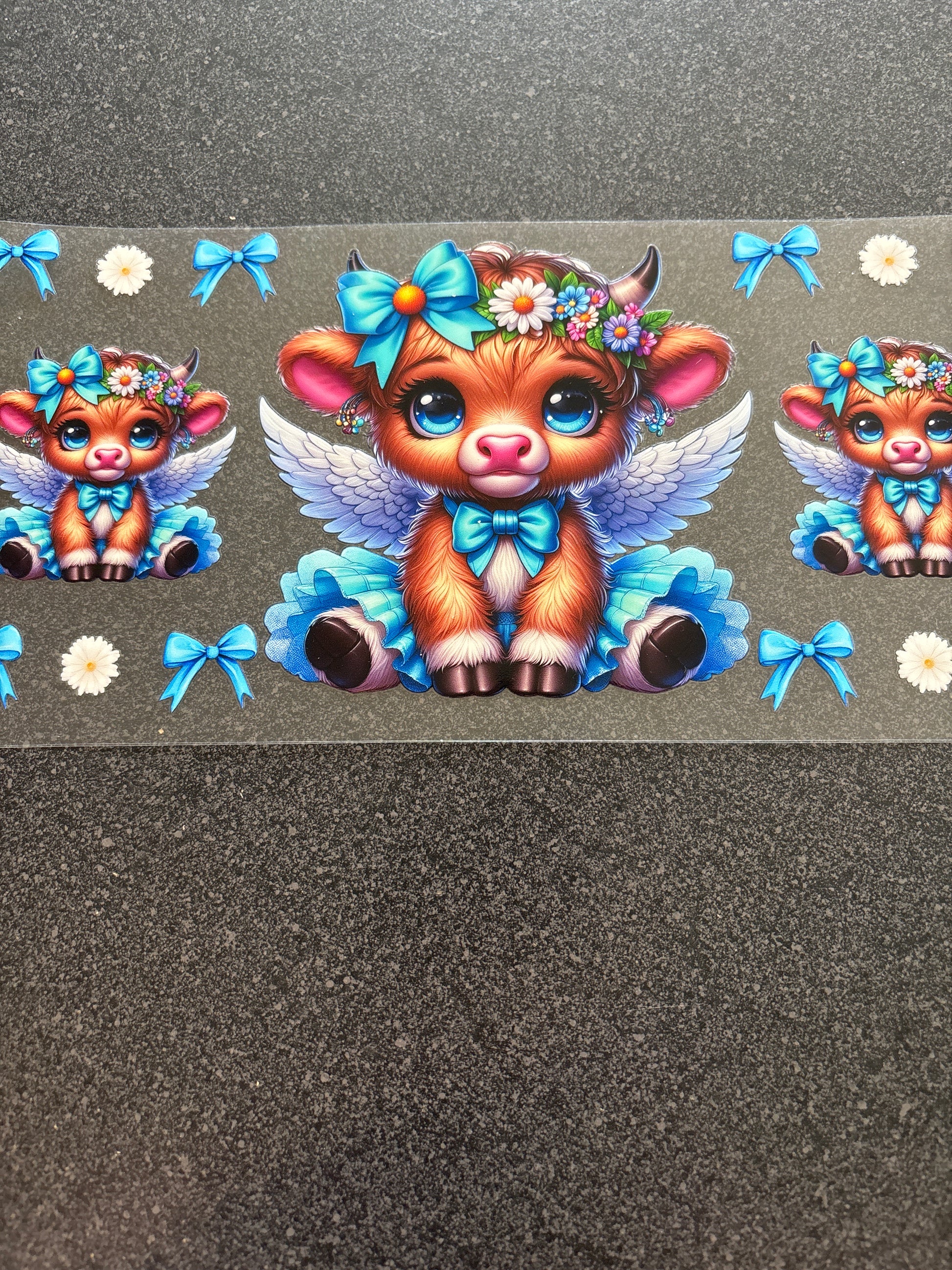 Highland cow with wings and blue bows